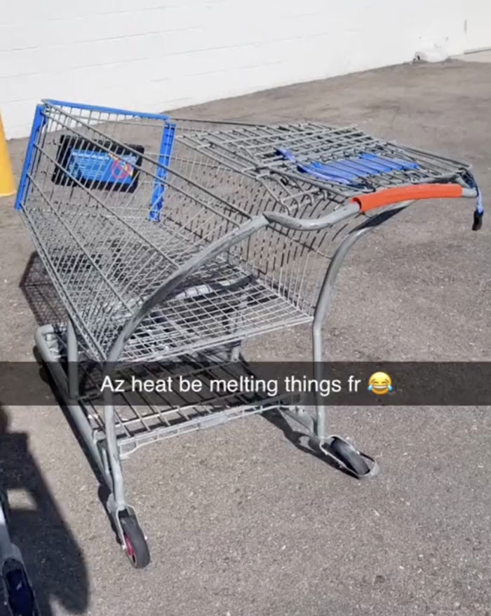 A shopping cart with its plastic parts clearly melting from extreme summer heat, showing summer ruining everything.