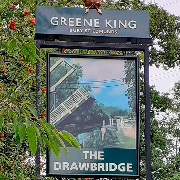 A Greene King pub sign for The Drawbridge with an illustration of a bridge. A case about a violent kidnapping. A Greene King pub sign for The Drawbridge with an illustration of a bridge. A case about a violent kidnapping.