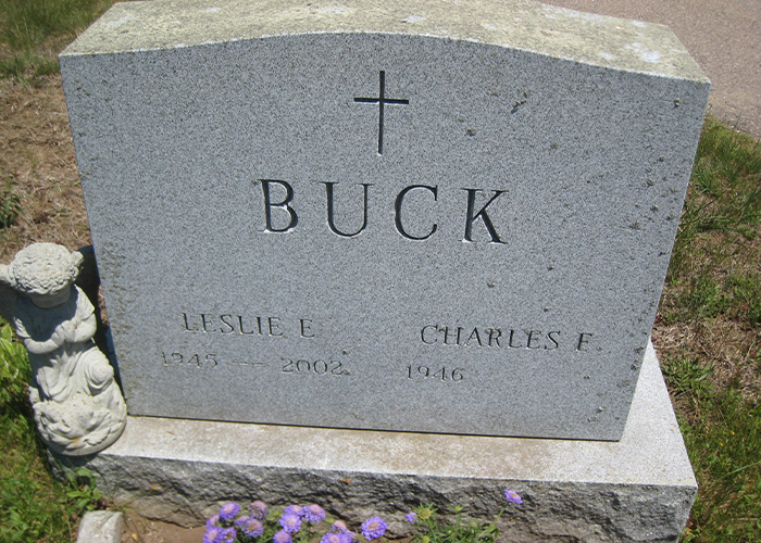 A gravestone with the name BUCK and dates 1945-2002, 1946, representing a life lost after a violent kidnapping. A gravestone with the name BUCK and dates 1945-2002, 1946, representing a life lost after a violent kidnapping.