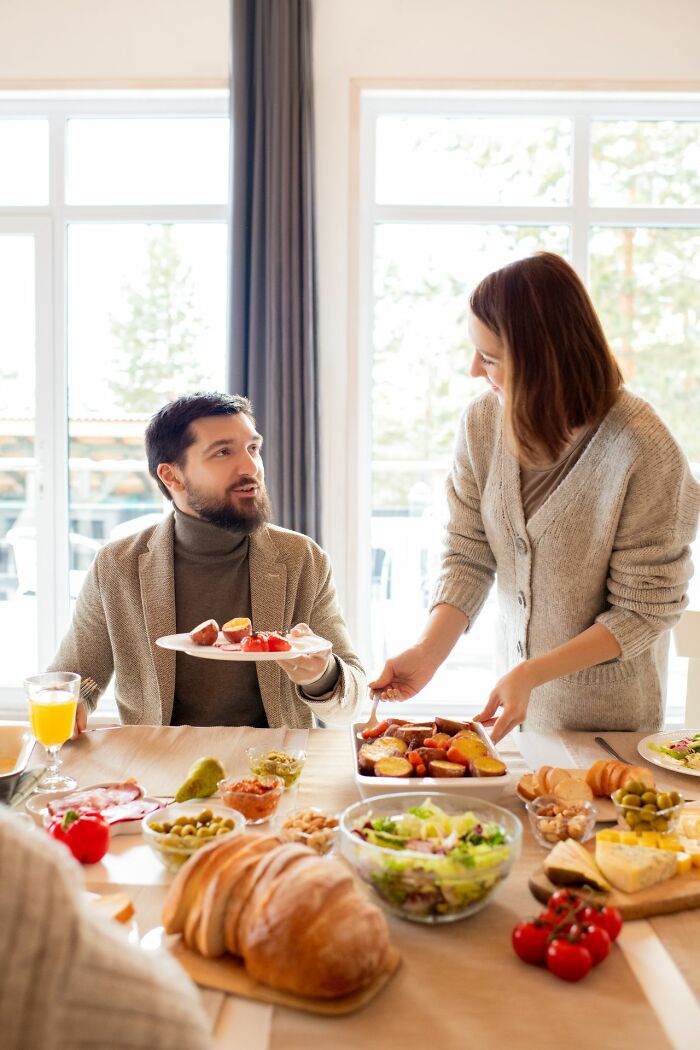 A family enjoying a meal together, emphasizing the strong family values America does better.
