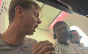 Passenger Confronts Total Stranger For Chewing With His Mouth Open On Plane, Sparks Viral Debate