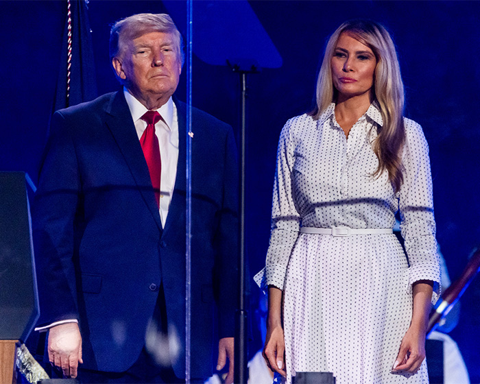 Donald Trump and Melania standing formally at an event, addressing public scrutiny.