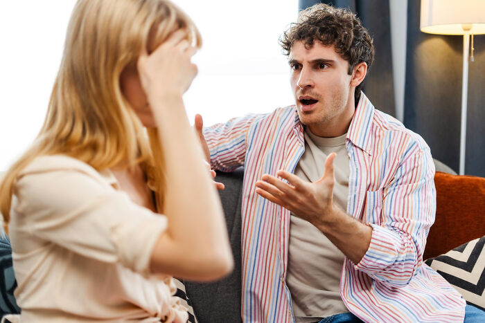 A man argues with a woman, discussing why they signed divorce papers instead of fighting.