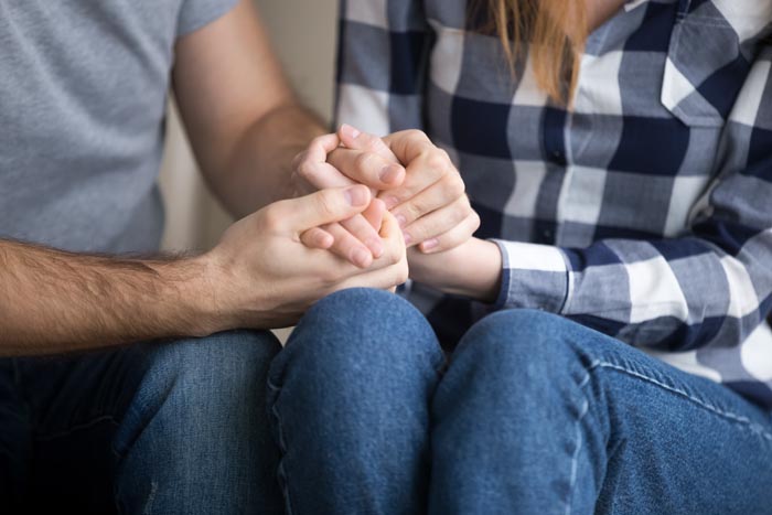 A couple holding hands, one of the MILs you wouldnt wish upon your worst enemy.