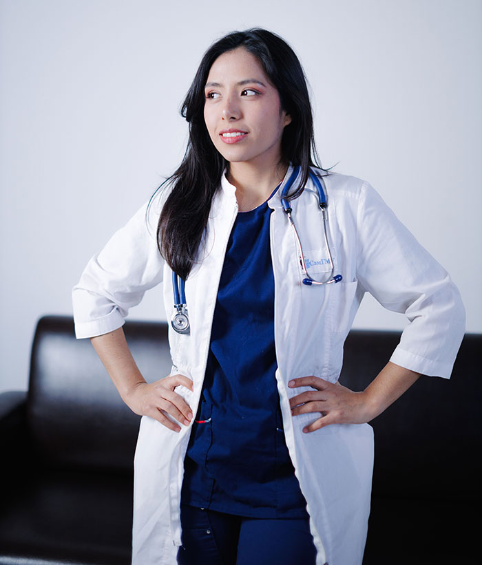 A female doctor with a stethoscope, standing confidently, ready to hear what patients said.