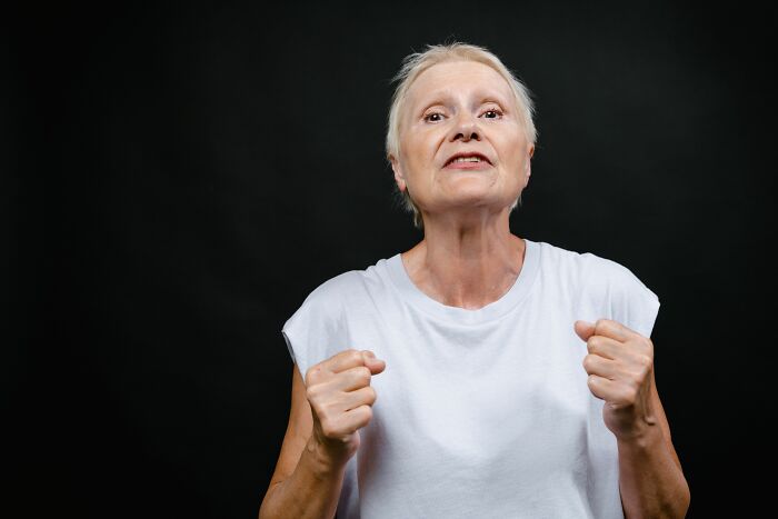 An elderly woman with a determined expression, symbolizing patients who said weird things.