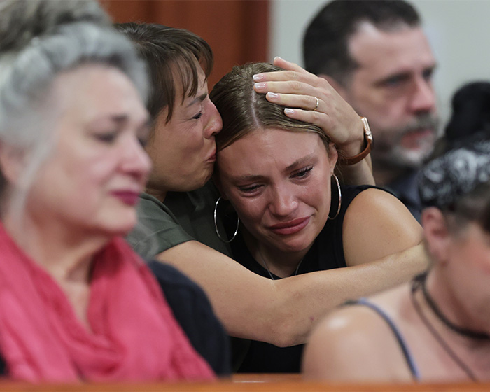 A woman crying, comforted by another, in the context of Bryan Kohberger targeting a house. A woman crying, comforted by another, in the context of Bryan Kohberger targeting a house.