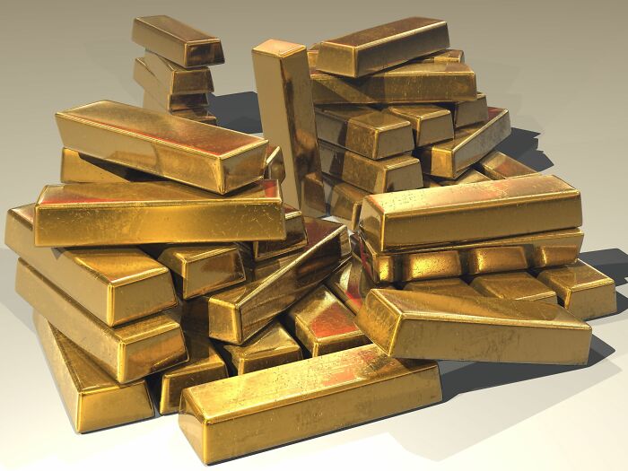 A pile of gleaming gold bars, representing some of the intriguing mysteries of WWII that are still unsolved.
