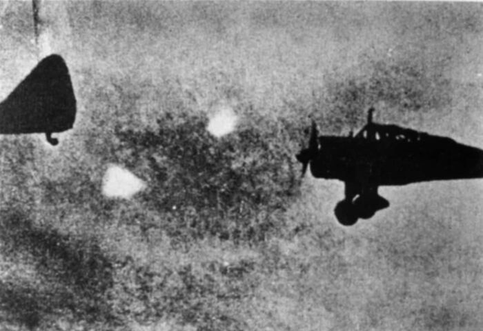 A blurry black and white image of a plane in flight, hinting at unsolved WWII mysteries and unexplained aerial phenomena.