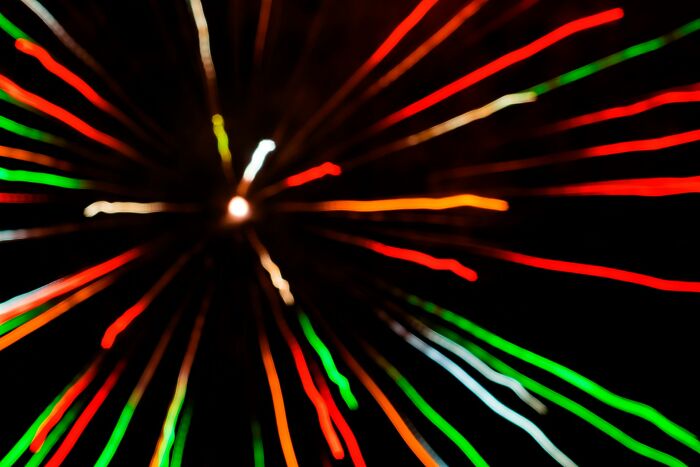 Abstract light trails resembling a burst, illustrating the impactful stories of life and what comes after.