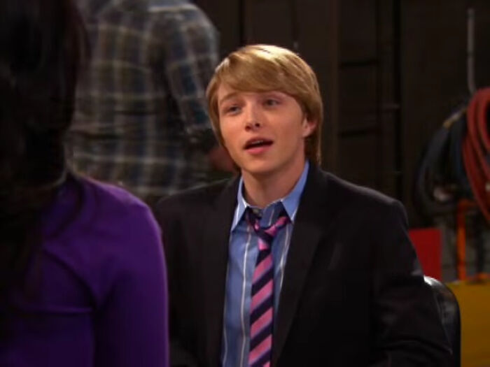 A young, clean-shaven Disney heartthrob from their earlier career, looking recognizable.