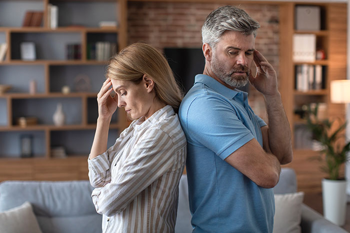 A couple back-to-back, stressed and contemplating walking away from constant drama with husband's kid. A couple back-to-back, stressed and contemplating walking away from constant drama with husband's kid.