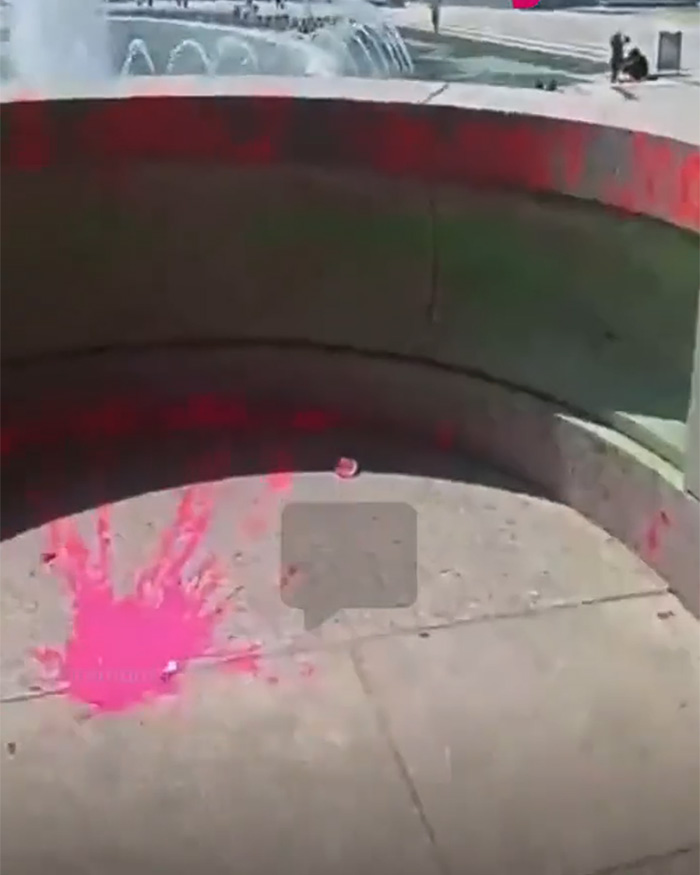 The WWII Memorial after being vandalized with red paint, highlighting the fury-inducing act.