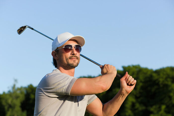 Man golfing, highlighting comments from women that made men go from planning date nights to planning their escape.
