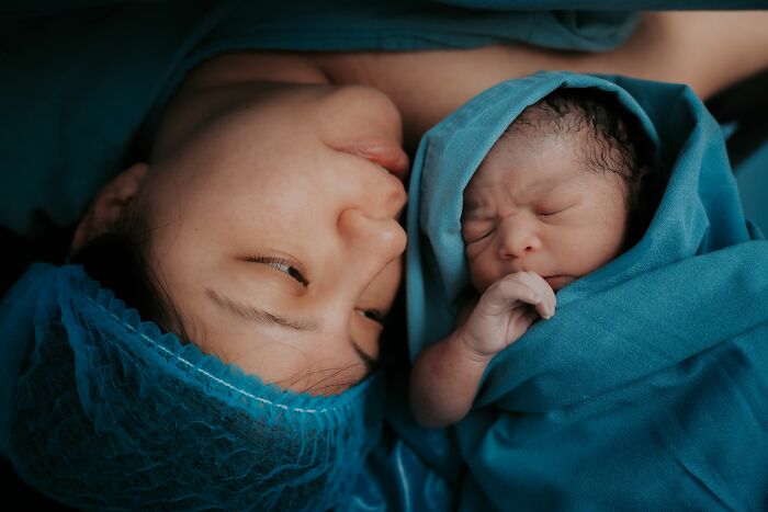 A mother and her newborn baby, representing the life changes women experience before walking away.