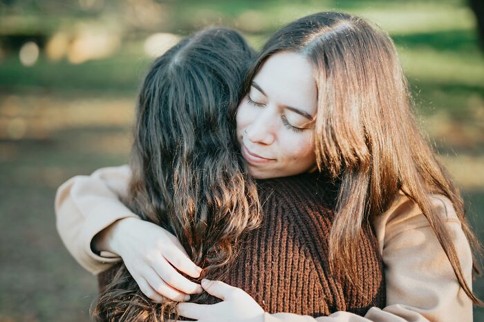 Two women embracing, perhaps comforting each other over a young and dumb decision.