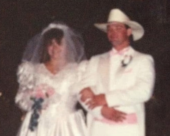 A blurred photo of a wedding, possibly related to the woman in the viral Zillow listing. A blurred photo of a wedding, possibly related to the woman in the viral Zillow listing.