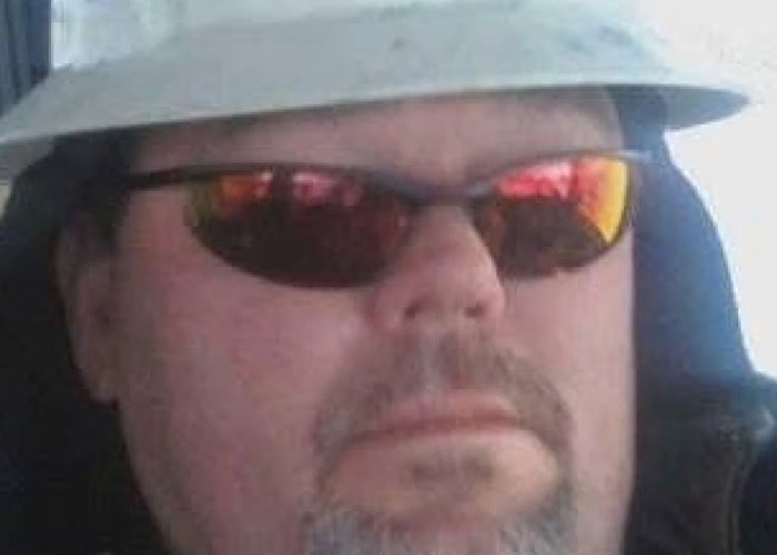 A man wearing sunglasses and a hat from the viral Zillow listing where the buyer must remove the woman. A man wearing sunglasses and a hat from the viral Zillow listing where the buyer must remove the woman.