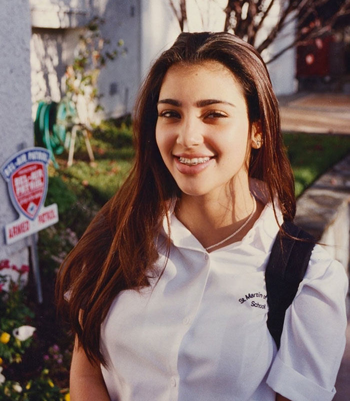 Kim Kardashian at 13, smiling with braces and a backpack, showcasing a parenting comparison.