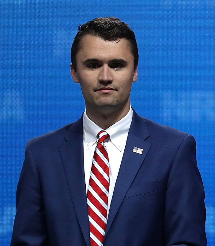 Charlie Kirk stands solemnly, following his passing, as Erika Kirk faces accusations of mocking him. Charlie Kirk stands solemnly, following his passing, as Erika Kirk faces accusations of mocking him.