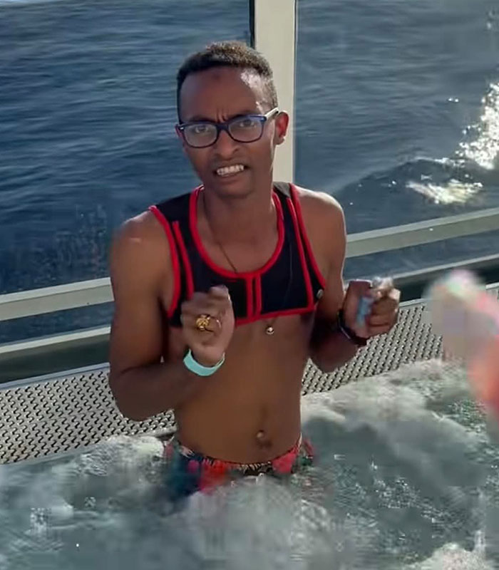 Alleged cruise ticket scammer pastor in a hot tub, facing scrutiny. Alleged cruise ticket scammer pastor in a hot tub, facing scrutiny.