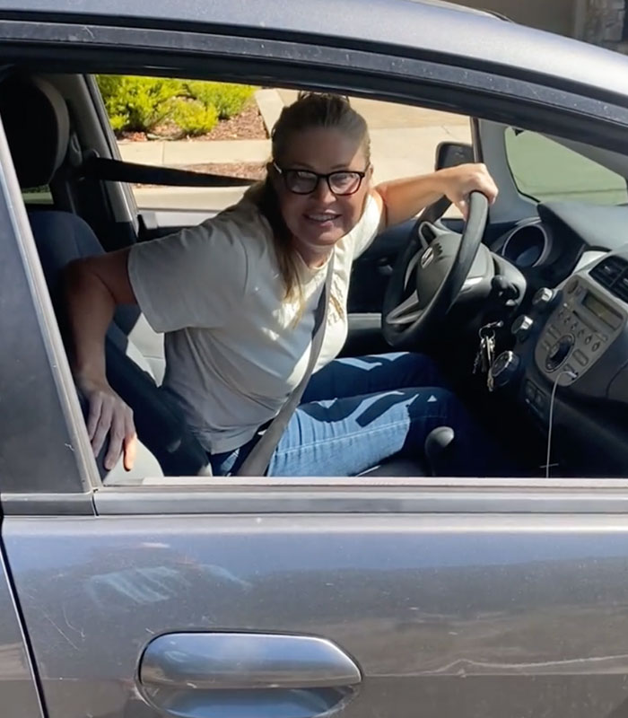 A white woman, known as the Racist Karen, looking angry in her car. A white woman, known as the Racist Karen, looking angry in her car.