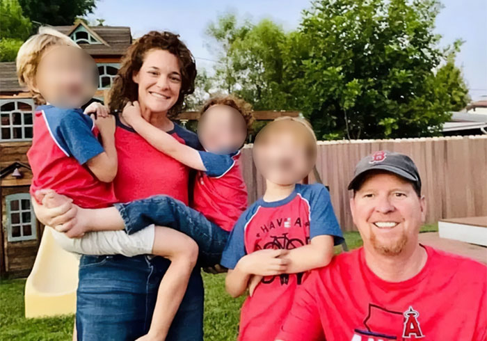 A happy dad of 3 and his family posing together outdoors. A happy dad of 3 and his family posing together outdoors.