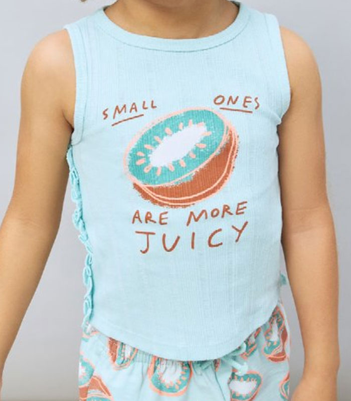 Close-up of the controversial girls' t-shirt with the message Small ones are more juicy, sparking a viral mom's protest. Close-up of the controversial girls' t-shirt with the message Small ones are more juicy, sparking a viral mom's protest.