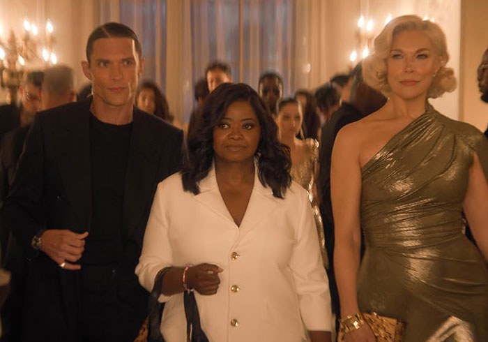 Cast members in formal wear on set, showcasing the popular Amazon female-centric show.