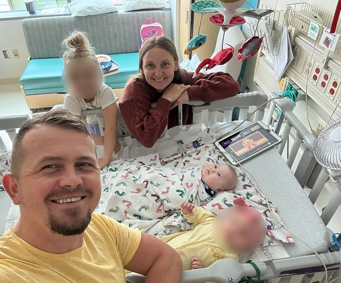 Family with children in hospital room highlighting hospital lawsuit over grieving parents Family with children in hospital room highlighting hospital lawsuit over grieving parents