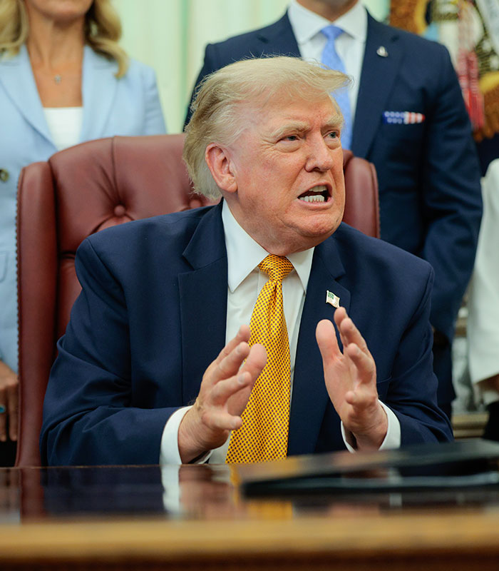Donald Trump gesturing during a speech, referenced in the Karoline Leavitt discussion Donald Trump gesturing during a speech, referenced in the Karoline Leavitt discussion