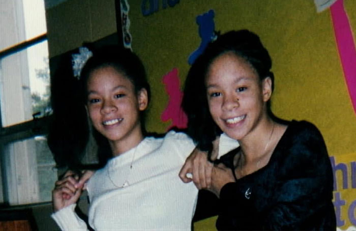 Two young twins smiling together side-by-side in school portraits Two young twins smiling together side-by-side in school portraits