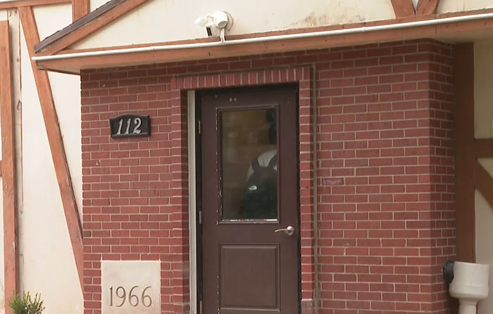 Close-up of entrance to building tied to frat leaders arrested in suspected hazing incident Close-up of entrance to building tied to frat leaders arrested in suspected hazing incident