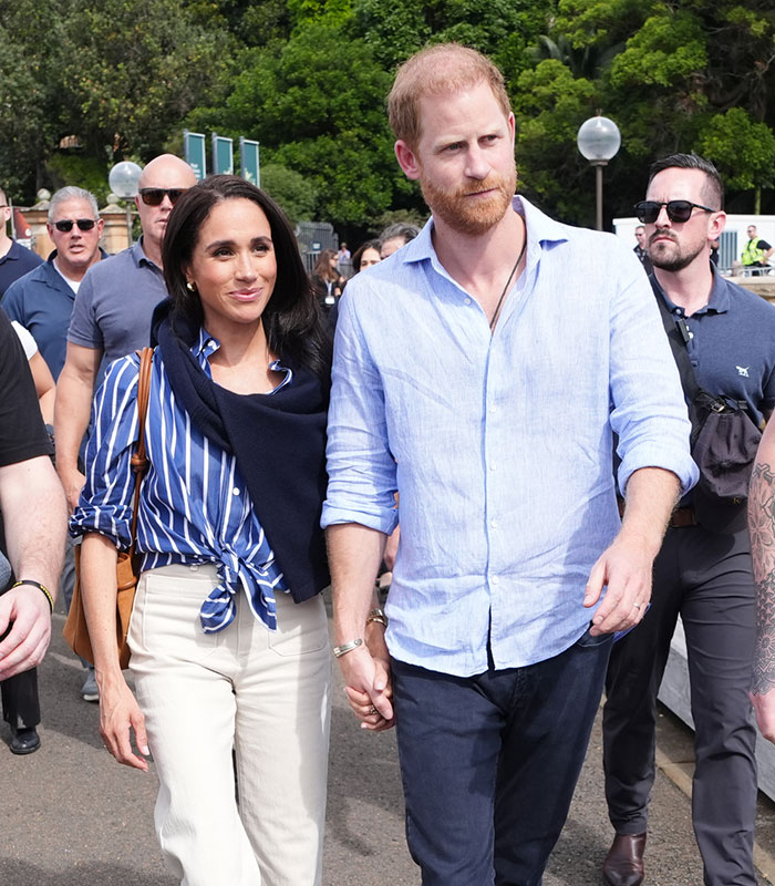 Meghan and Harry walk hand-in-hand, following King Charles' statement on their UK move. Meghan and Harry walk hand-in-hand, following King Charles' statement on their UK move.
