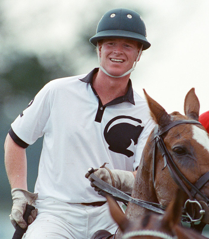 A man resembling Prince Harry in a polo helmet on horseback, fueling discussions about Prince Harry's paternity. A man resembling Prince Harry in a polo helmet on horseback, fueling discussions about Prince Harry's paternity.