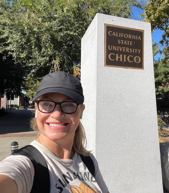 The Racist Karen smiling in front of the California State University, Chico sign. The Racist Karen smiling in front of the California State University, Chico sign.