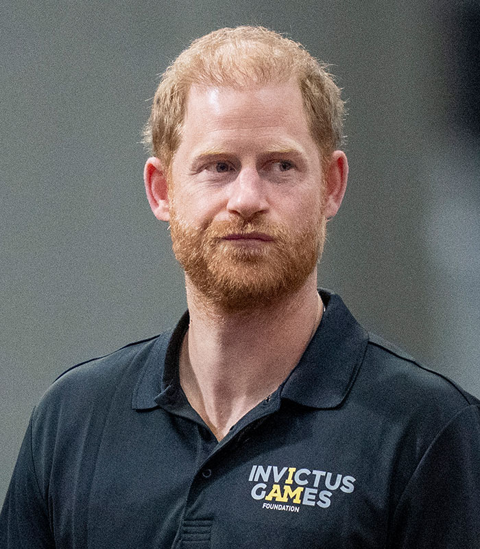 Prince Harry in an Invictus Games polo shirt, part of the Meghan and Harry story.