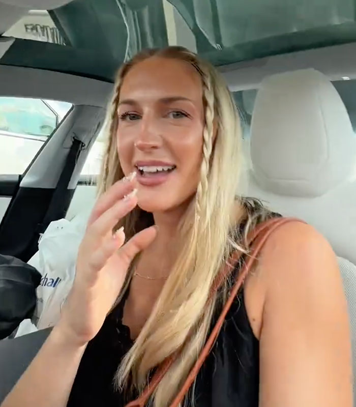 A blonde shopper talking in her car about a confrontation with a Karen.