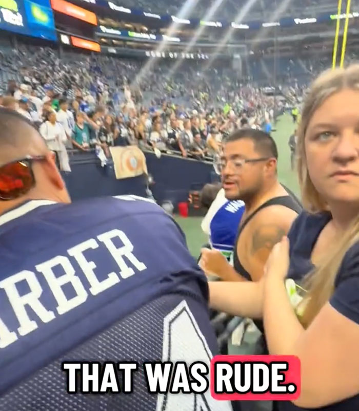 Karen with a stern look during an NFL match in the stands. Karen with a stern look during an NFL match in the stands.