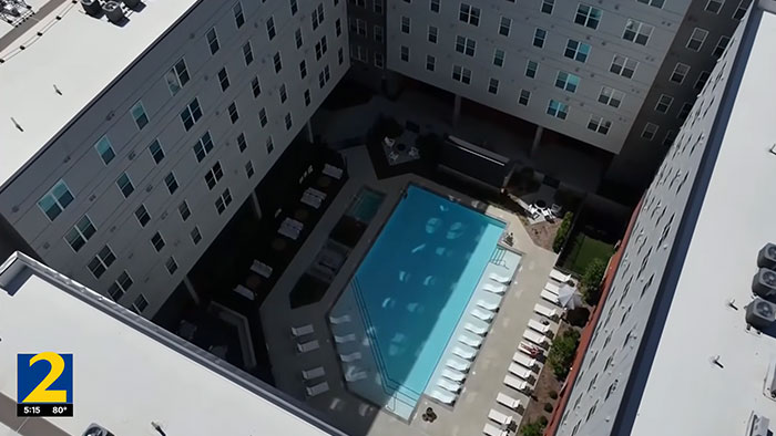 High-angle view of the apartment building and courtyard where the UGA student fell. High-angle view of the apartment building and courtyard where the UGA student fell.