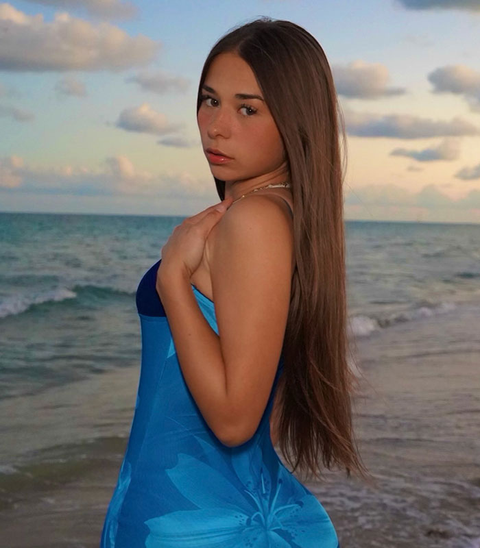Sophie Rain on a beach, by the ocean, showing the results of her 50lbs weight loss in a blue patterned dress. Sophie Rain on a beach, by the ocean, showing the results of her 50lbs weight loss in a blue patterned dress.