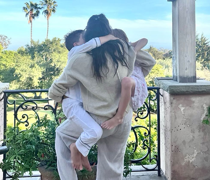Meghan Markle embracing children, related to the story about her demands for a new UK home. Meghan Markle embracing children, related to the story about her demands for a new UK home.