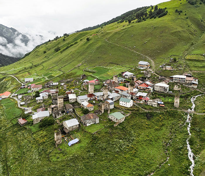 A village in a green mountain landscape, representing a new UK home context for Meghan Markle. A village in a green mountain landscape, representing a new UK home context for Meghan Markle.