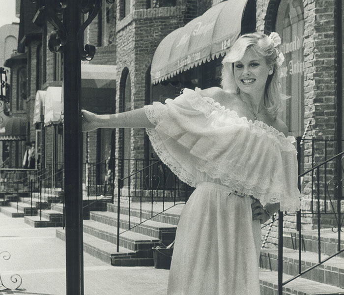 Hollywood beauty goddess Dorothy Stratten poses in a flowing dress on a city street. Hollywood beauty goddess Dorothy Stratten poses in a flowing dress on a city street.