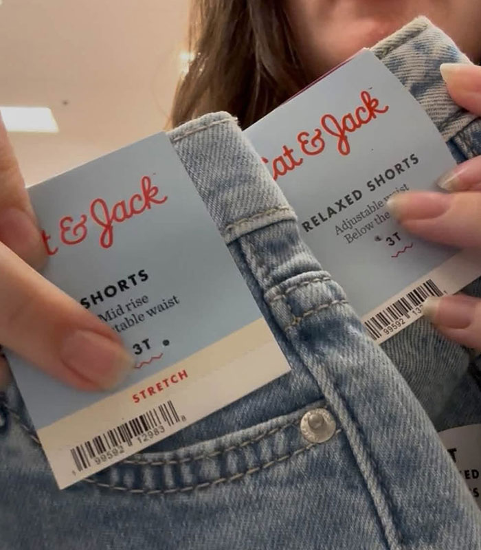 Close-up of girls' t-shirt labels, highlighting the sizing issue viral mom discusses. Close-up of girls' t-shirt labels, highlighting the sizing issue viral mom discusses.