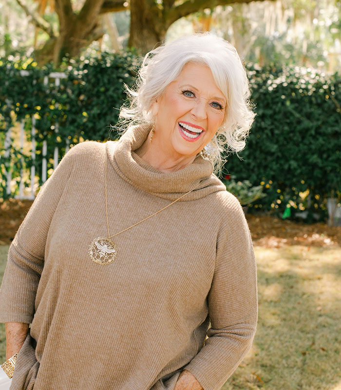Paula Deen smiling outside, who previously faced consequences similar to the woman hurling N-word incident. Paula Deen smiling outside, who previously faced consequences similar to the woman hurling N-word incident.