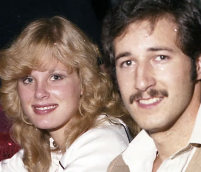 A young Hollywood beauty goddess smiles with a man, a key figure in her career and later, her life. A young Hollywood beauty goddess smiles with a man, a key figure in her career and later, her life.