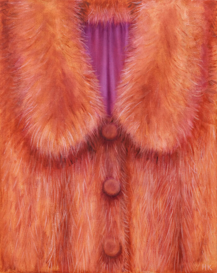 A striking portrait of identity showing a luxurious orange fur coat with a purple lining and three buttons.