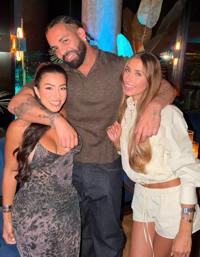 Lily Phillips with a man and another woman, fixated on a detail after her claim. Lily Phillips with a man and another woman, fixated on a detail after her claim.