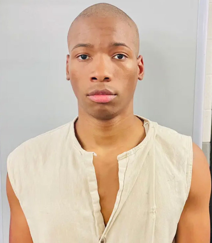 A young, bald man, possibly Karmelo Anthony, revealing hateful texts from new court documents.